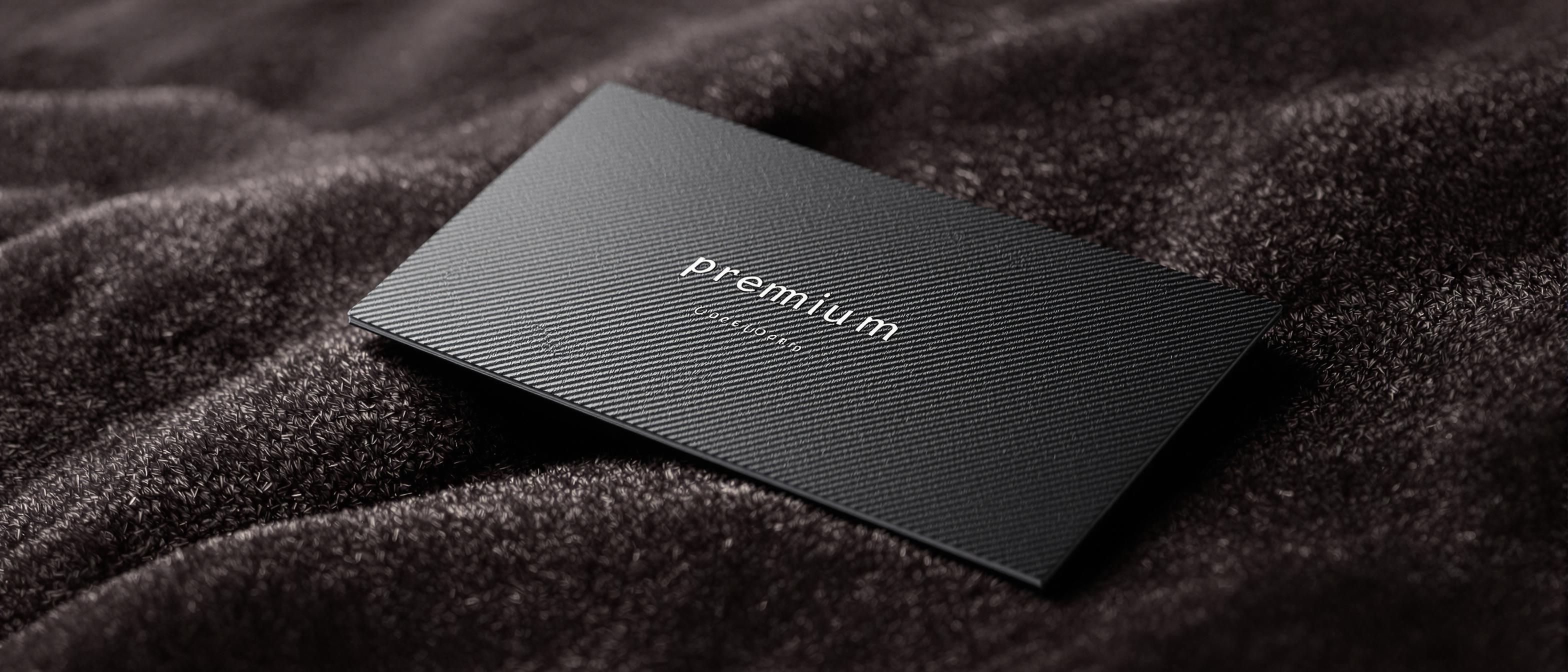 An elegantly textured card rests on a velvet surface, highlighting its tactile qualities.