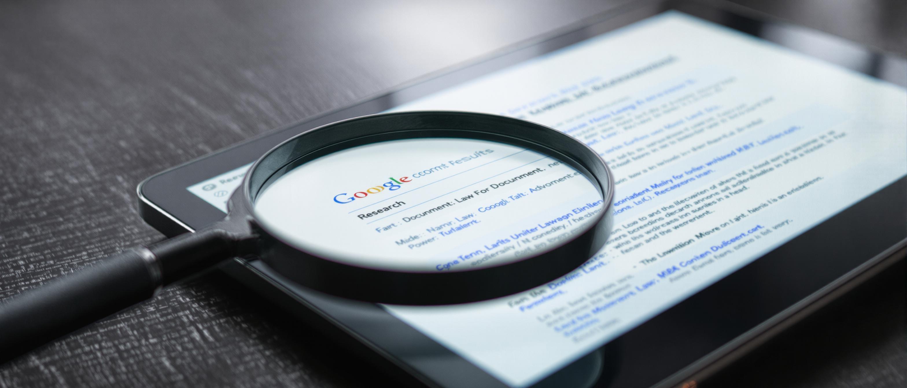 A magnifying glass hovers above a digital tablet displaying search results and legal documents, creating a scene focused on investigation and information.