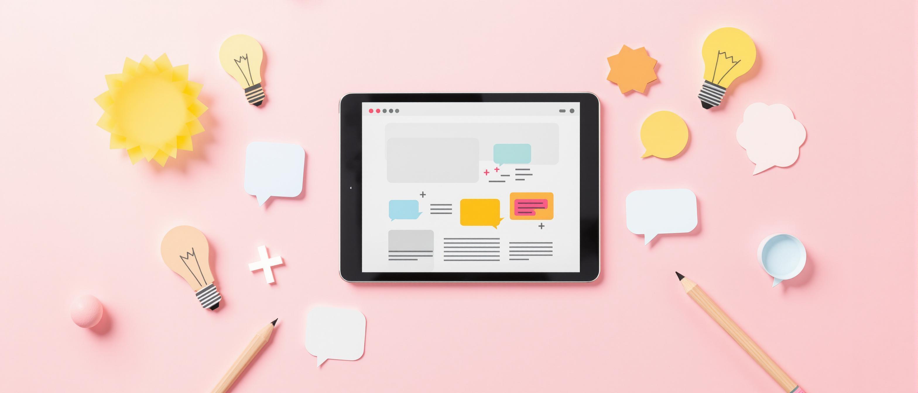 A vibrant arrangement of creative symbols like lightbulbs and pencils surrounding a computer screen in soft pastel colors.